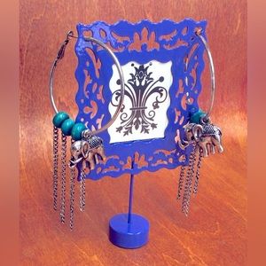 Big Hoop Earrings with accents of chains, beads and elephants.